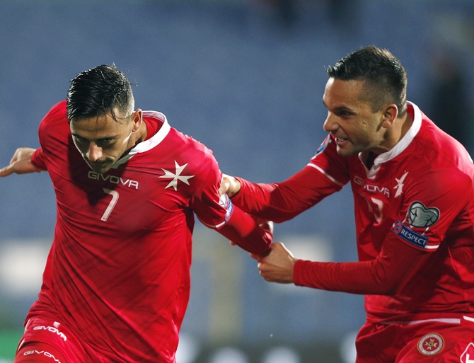 Malta's Failla celebrates with his teammate Schembri after scoring a goal against Bulgaria during their Euro 2016 Group H qualification soccer match at Vassil Levski stadium in Sofia
