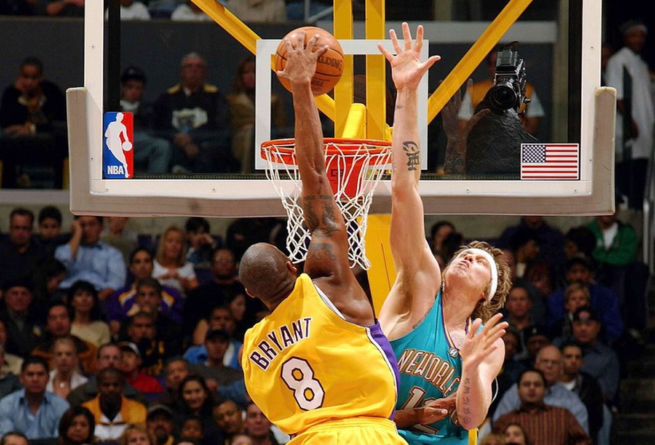 LOS ANGELES - DECEMBER 22: Kobe Bryant #8 of the Los Angeles Lakers slam dunks over Chris Andersen #12 of the New Orleans Hornets on December 22, 2004 at the Staples Center in Los Angeles, California.  NOTE TO USER:  User expressly acknowledges and agrees that, by downloading and/or using this photograph, User is consenting to the terms and conditions of Getty Images License Agreement.  Mandatory Copyright Notice: Copyright 2004 NBAE  (Photo by Noah Graham/NBAE via Getty Images)