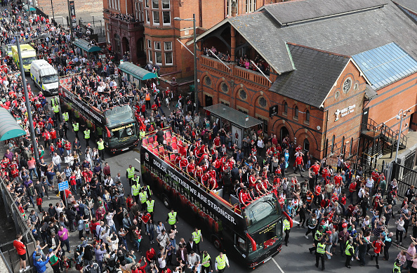 CARDIFF, WALES - JULY 08: Fans cheer as they line Westgate Street to welcome the Wales team home following their exit from the Euro 2016 championships, on July 8, 2016 in Cardiff, Wales. Wales' fairytale run ended on Wednesday after they were beaten 2-0 by Portugal in their Euro 2016 semi-final match (Photo by Matt Cardy/Getty Images)