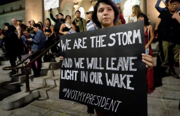 A protestor holds a sign during a rally against the election of Republican Donald Trump as President of the United States in Los Angeles